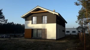 Domy energooszczędne Poznań - dom piętrowy z dachem dwuspadowym i garażem